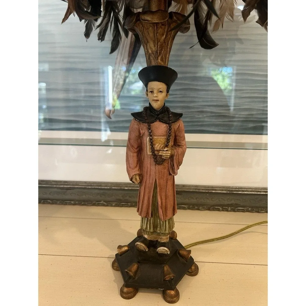 Chinoiserie-style Asian man table lamp manufactured by Berman W/feather shade